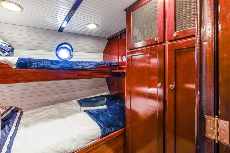 Slide: The Image of Cozy cabin with wooden bunk beds on 1929 Lyman-Morse Staysail Schooner. - 43