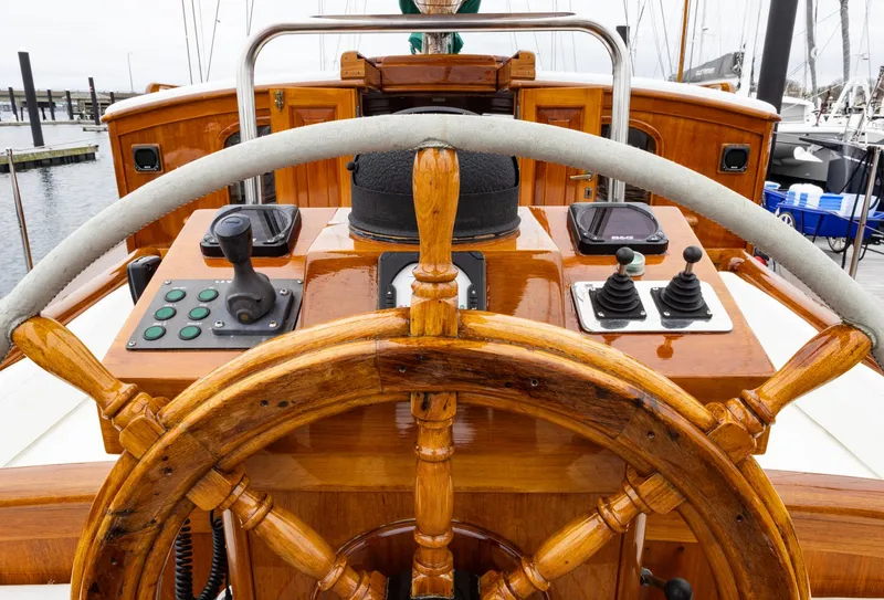 Slide: The Image of Wooden helm of a 1929 Lyman-Morse Staysail Schooner with modern controls. - 5
