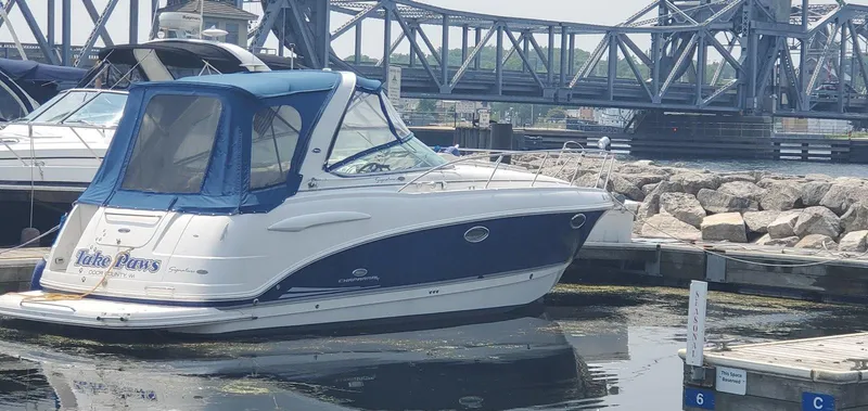 The Image of 2006 Chaparral 290 Signature boat docked near a bridge. - 0