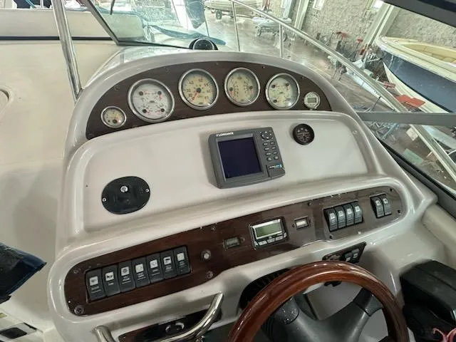 Slide: The Image of Control panel of 2006 Chaparral 290 Signature boat with gauges and navigation equipment. - 7