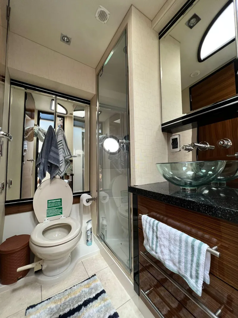 Slide: The Image of 2011 Marquis 500 Sport Coupe bathroom with glass shower, toilet, and modern sink. - 4
