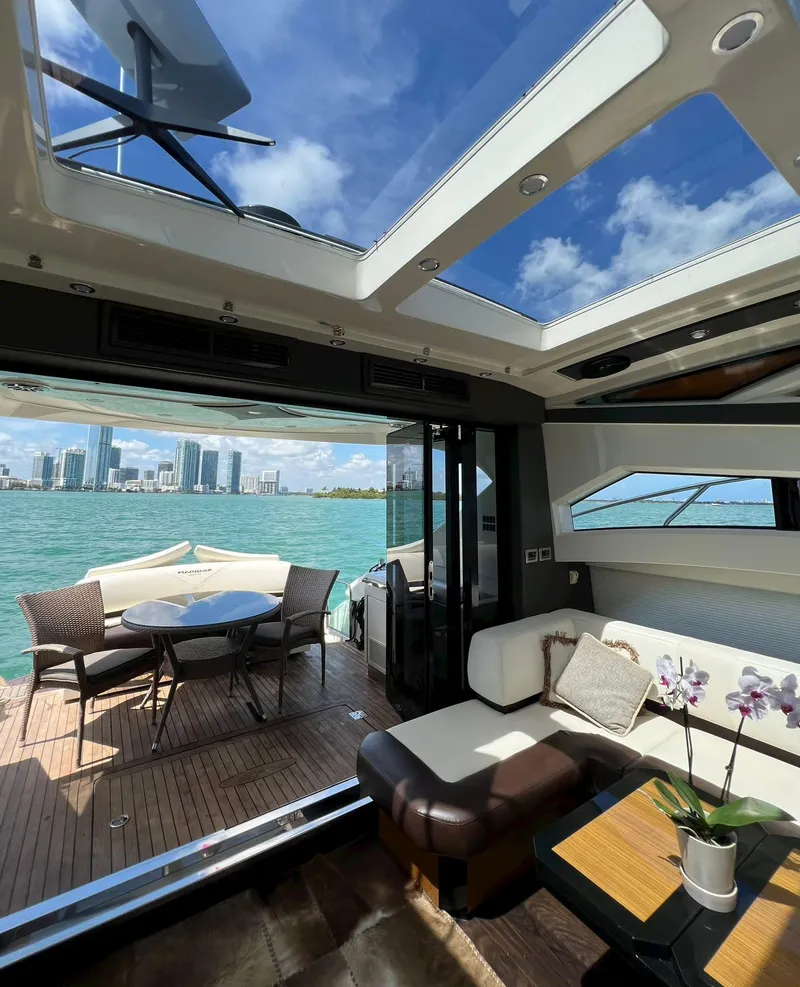 Slide: The Image of Interior of a 2011 Marquis 500 Sport Coupe yacht with city skyline view. - 8