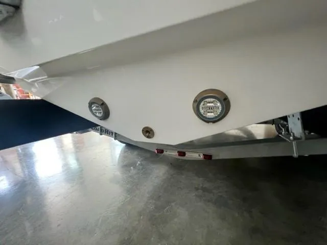 Slide: The Image of 2024 Blackfin 252 DC boat stern with underwater lights and trailer. - 16