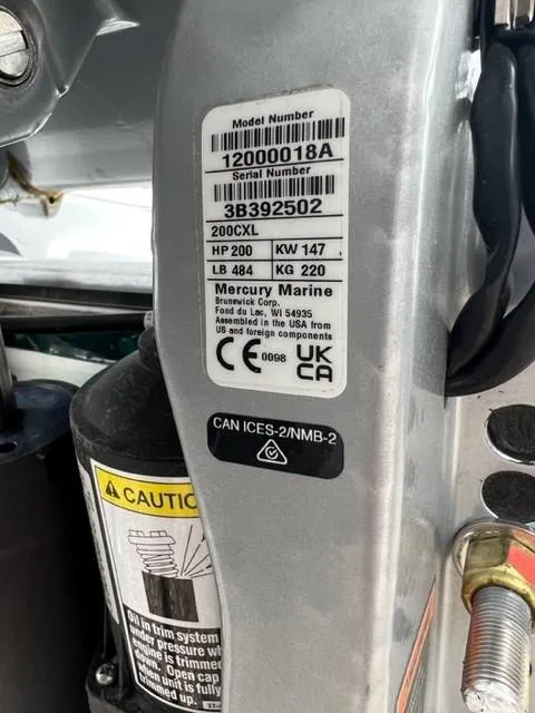 Slide: The Image of 2024 Blackfin 252 DC boat engine label showing Mercury Marine specifications and safety warnings. - 24