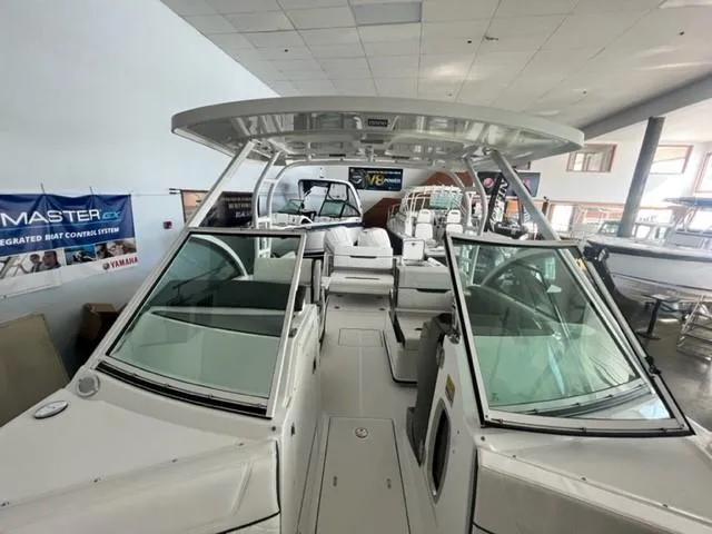 Slide: The Image of 2024 Blackfin 252 DC boat interior at a showroom. - 5