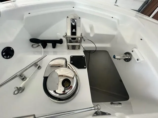 Slide: The Image of 2024 Blackfin 252 DC boat anchor locker with stainless steel windlass and cleats. - 6
