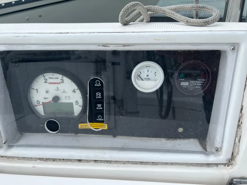 Slide: The Image of Control panel of a 2005 Hunter 36 sailboat with gauges and indicators. - 11