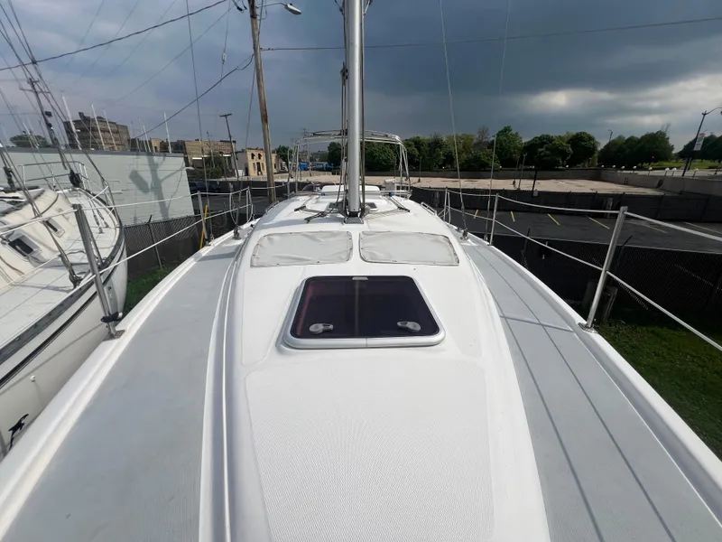 Slide: The Image of 2005 Hunter 36 sailboat deck view with hatch and mast. - 17