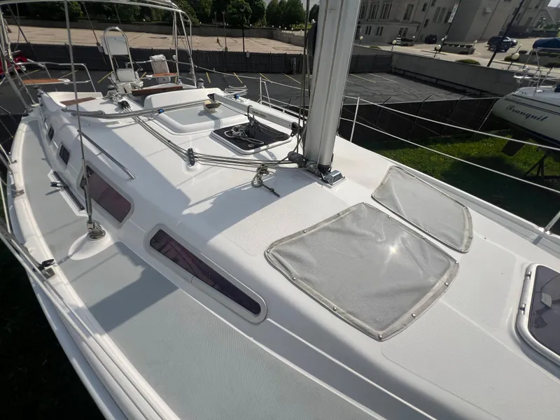 Slide: The Image of 2005 Hunter 36 sailboat deck with hatches and rigging. - 18