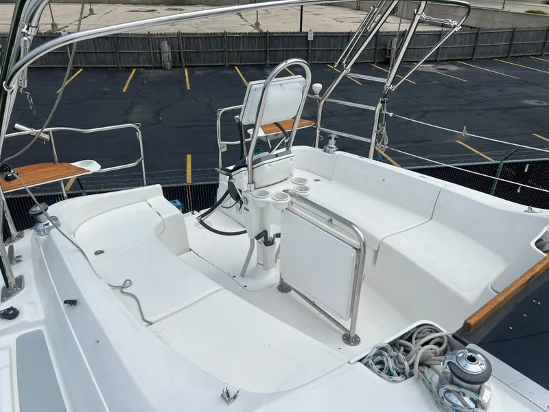 Slide: The Image of 2005 Hunter 36 sailboat cockpit with steering wheel and seating. - 21