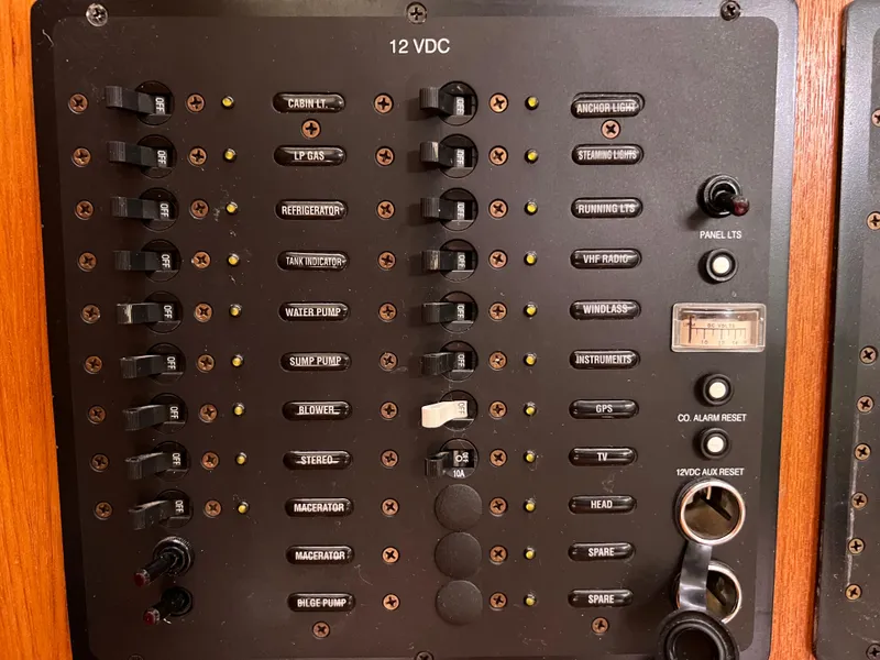 Slide: The Image of Hunter 36 2005 boat electrical control panel with labeled switches and indicators. - 35