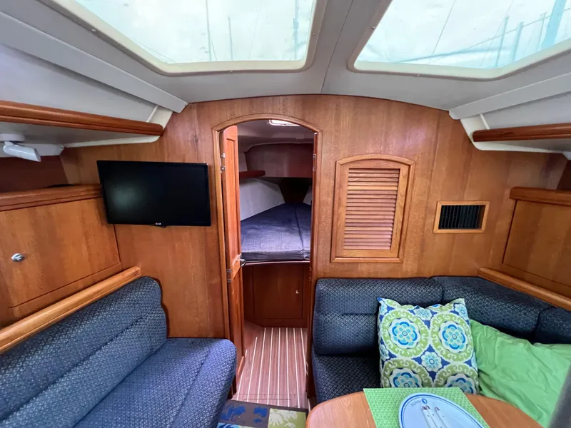 Slide: The Image of Interior of 2005 Hunter 36 sailboat with cozy seating and TV. - 41