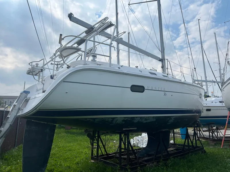 Slide: The Image of 2005 Hunter 36 sailboat on stands in a boatyard. - 6