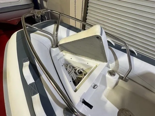 Slide: The Image of 2021 Novurania 360 DL boat bow with anchor storage and stainless steel railings. - 10