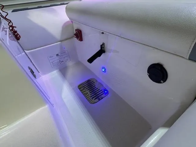 Slide: The Image of Interior of a 2021 Novurania 360 DL boat with control panel and blue LED lights. - 6