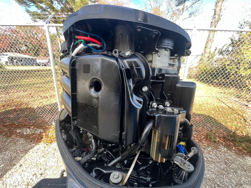 Slide: The Image of Close-up of a 2005 C-Hawk Pilothouse 25 boat engine, showcasing intricate mechanical details. - 21