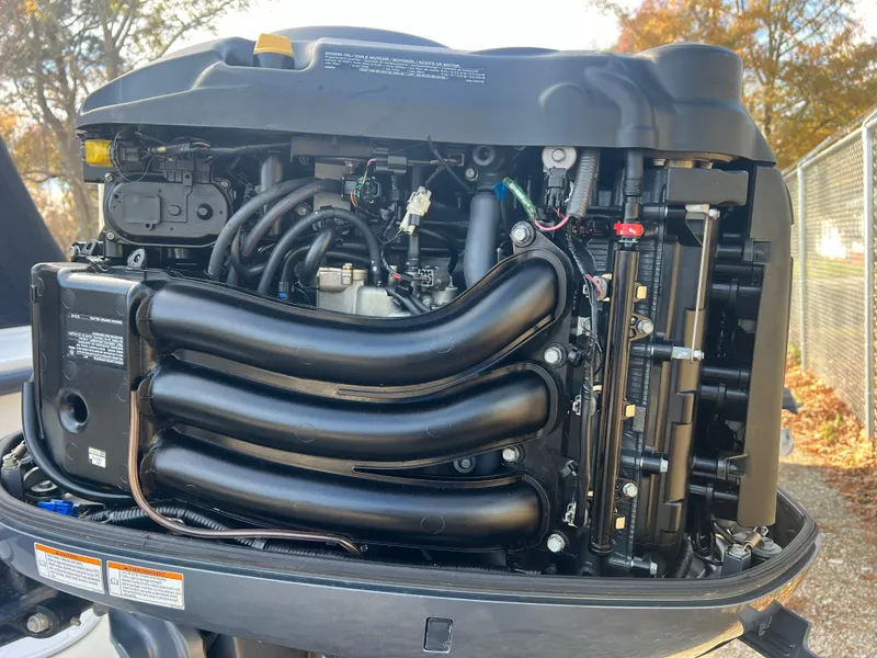 Slide: The Image of Close-up of a 2005 C-Hawk Pilothouse 25 engine, showcasing intricate mechanical details. - 22