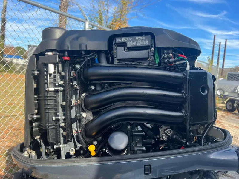 Slide: The Image of Close-up of a 2005 C-Hawk Pilothouse 25 engine, showcasing intricate mechanical details. - 23