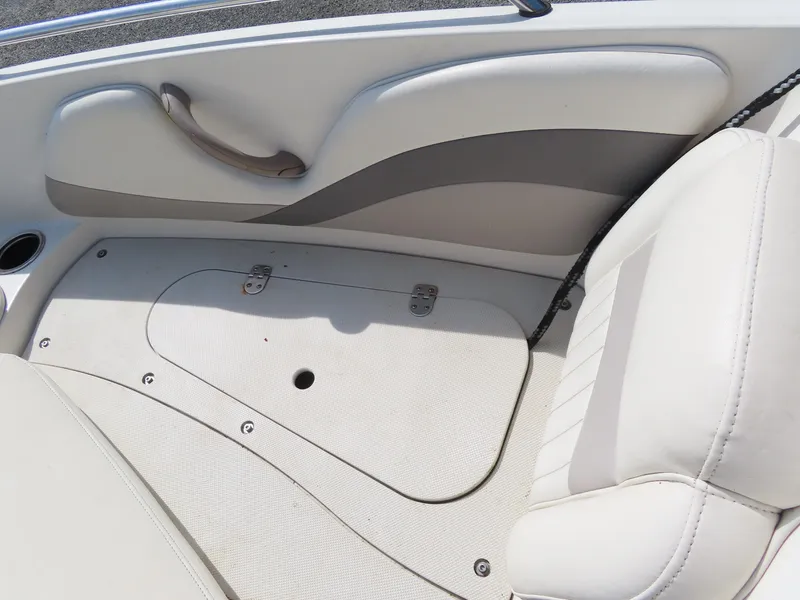Slide: The Image of Interior seating and storage compartment of a 2013 Stingray 195LX boat. - 12