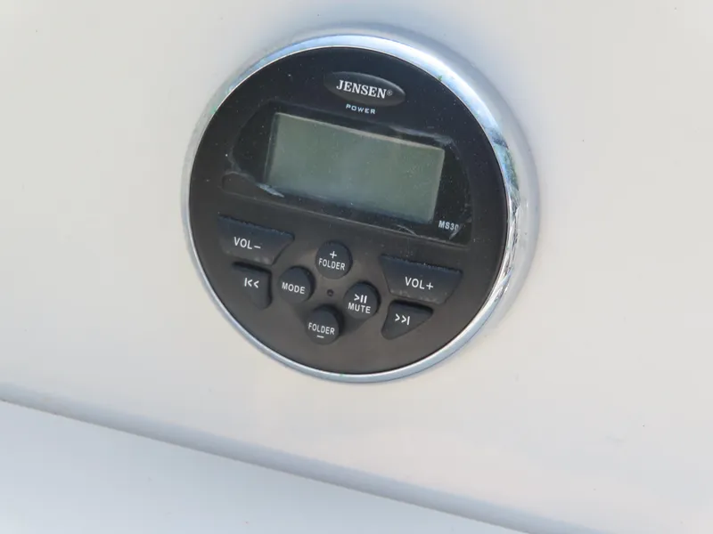 Slide: The Image of Jensen audio control panel on a 2013 Stingray 195LX boat. - 13