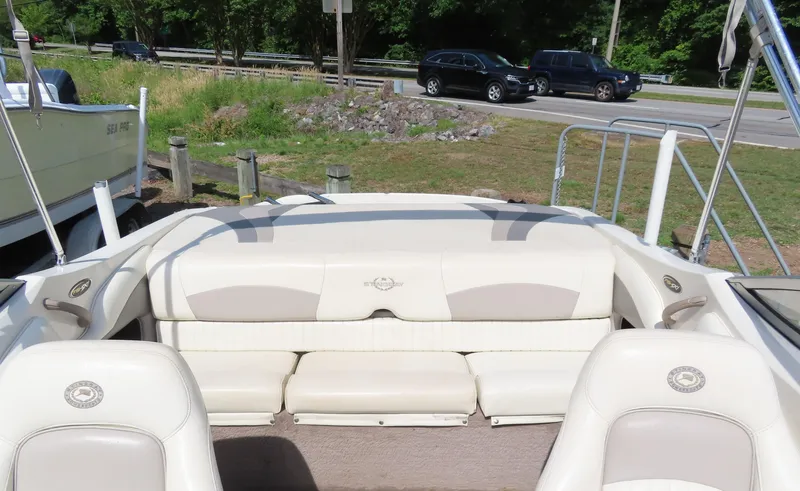 Slide: The Image of 2013 Stingray 195LX boat interior with white and beige seating. - 16