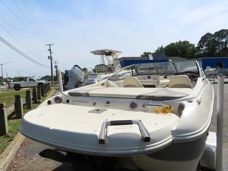 Slide: The Image of 2013 Stingray 195LX boat, rear view, parked outdoors. - 18