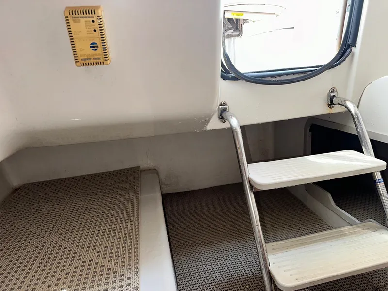 Slide: The Image of Interior of 2003 Hurricane 26 SD boat with steps and vent. - 16