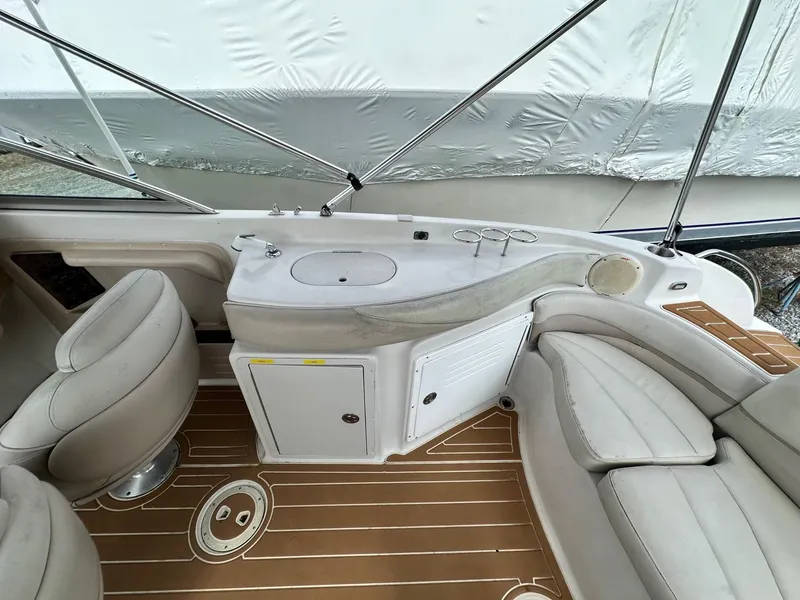 Slide: The Image of 2003 Hurricane 26 SD boat interior with seating and sink area. - 18