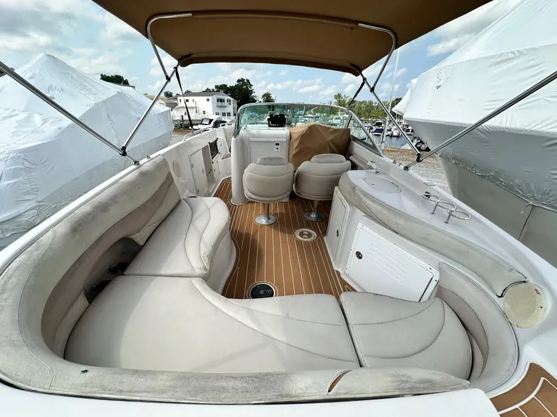 Slide: The Image of 2003 Hurricane 26 SD boat interior with spacious seating and canopy. - 7