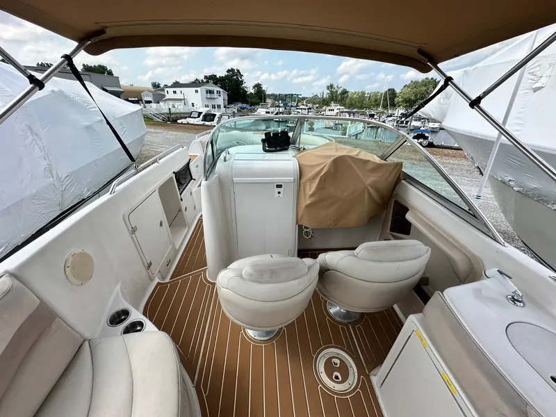 Slide: The Image of 2003 Hurricane 26 SD boat interior with seating and covered console. - 9