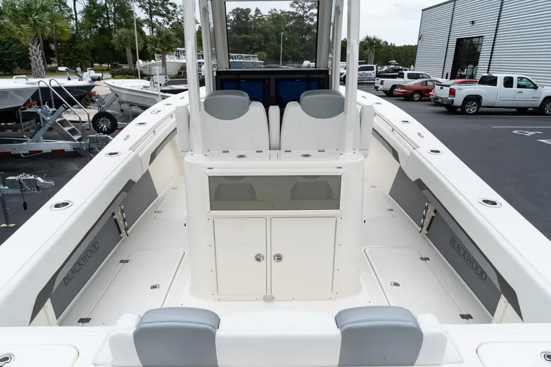 Slide: The Image of 2025 Blackwood 290 OPEN boat interior with seating and storage compartments. - 12