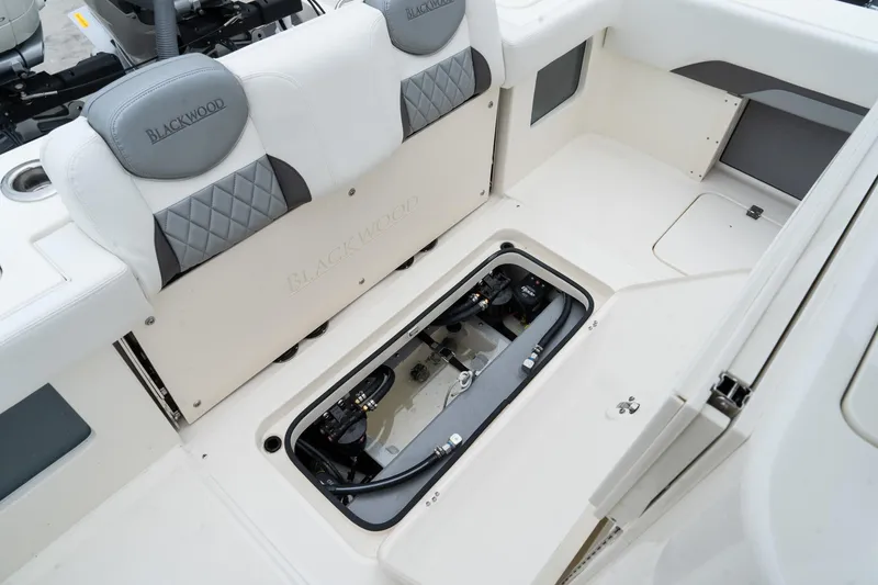 Slide: The Image of 2025 Blackwood 290 OPEN boat interior with open storage compartment. - 19