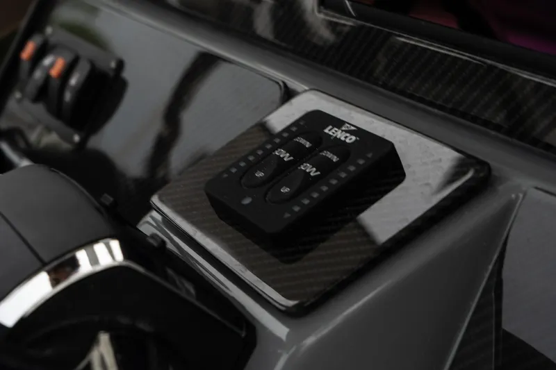 Slide: The Image of Control panel of the 2025 Blackwood 290 OPEN boat with Lenco trim tab switches. - 28