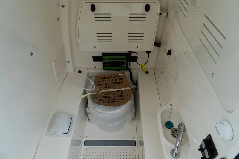 Slide: The Image of Interior of 2025 Blackwood 290 OPEN boat with toilet and sink. - 34