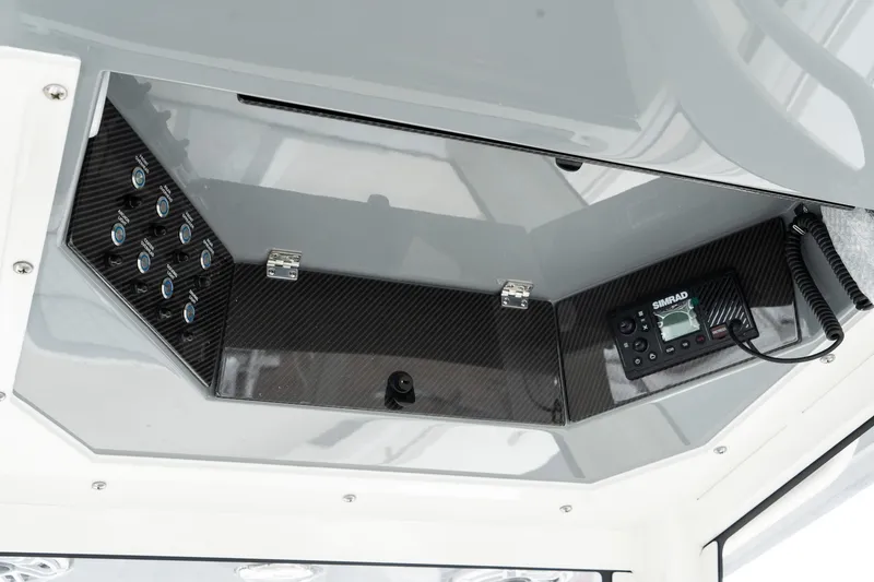 Slide: The Image of Blackwood 290 OPEN 2025 boat console with control panel and radio. - 39