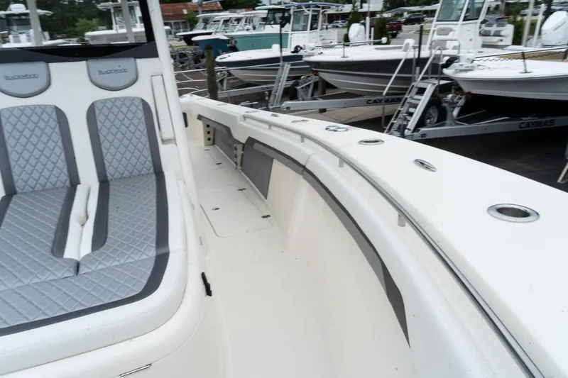 Slide: The Image of 2025 Blackwood 290 OPEN boat interior with seating and sleek design. - 45