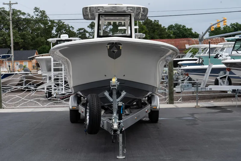 Slide: The Image of 2025 Blackwood 290 OPEN boat on trailer, front view at marina. - 5