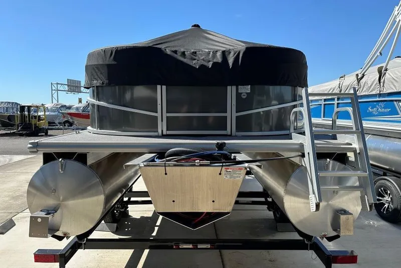 Slide: The Image of 2024 SunChaser Vista 18 LR pontoon boat interior with spacious seating and cup holders. - 4