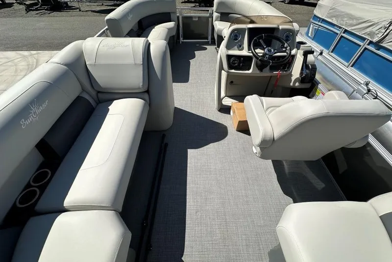 Slide: The Image of 2024 SunChaser Vista 18 LR boat dashboard with steering wheel and controls. - 7