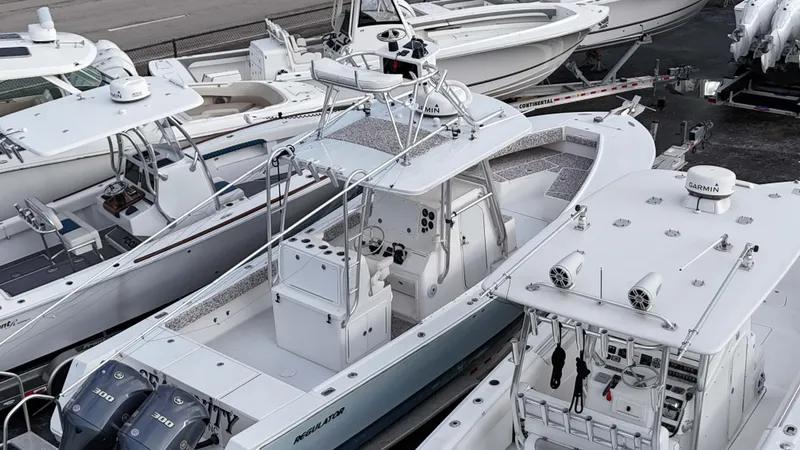 Slide: The Image of 2005 Regulator 32 Forward Seating boat docked among other boats. - 14