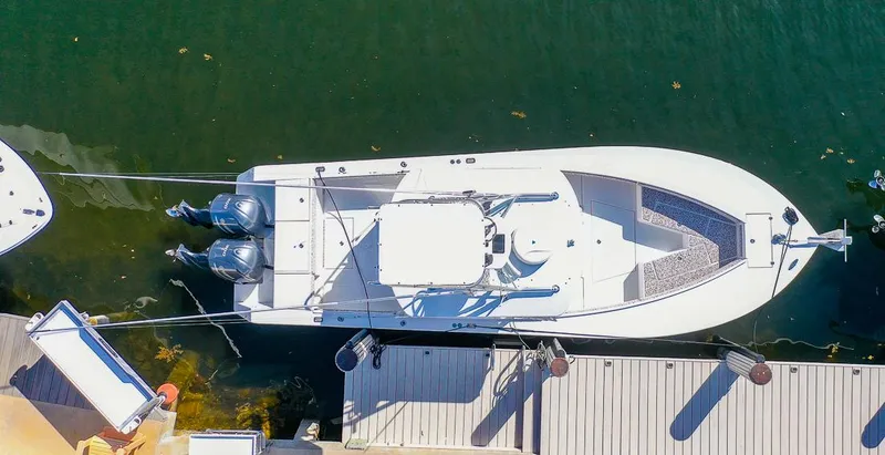 Slide: The Image of 2005 Regulator 32 Forward Seating boat docked aerial view. - 15
