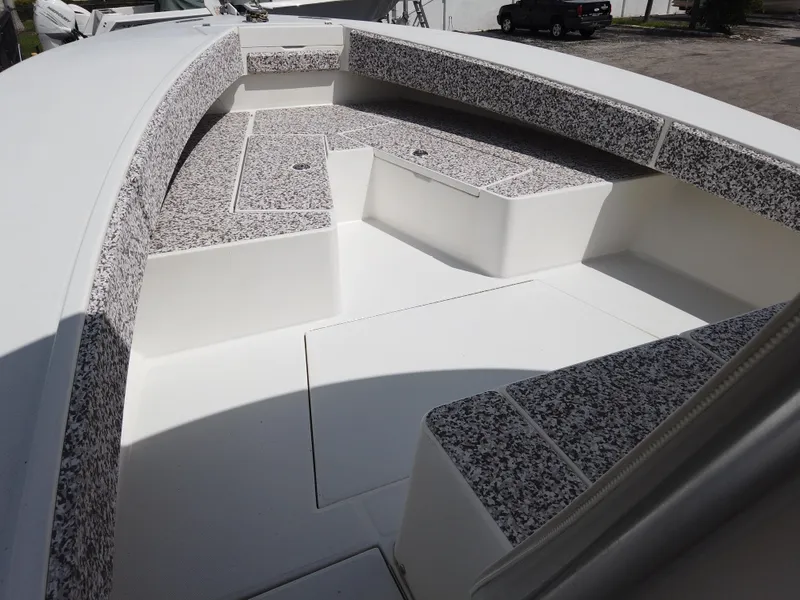 Slide: The Image of 2005 Regulator 32 Forward Seating boat interior with cushioned seating and spacious deck. - 35