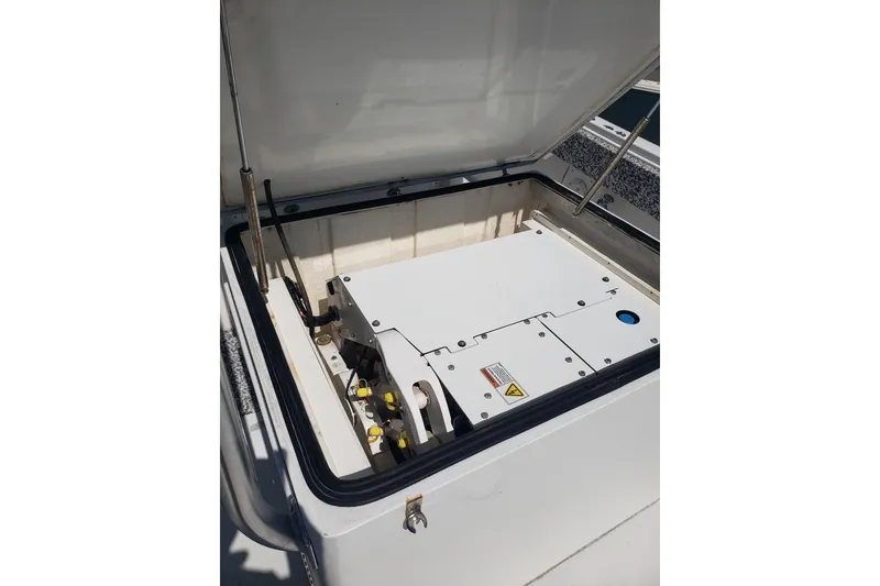 Slide: The Image of Open storage compartment on 2005 Regulator 32 Forward Seating boat. - 37