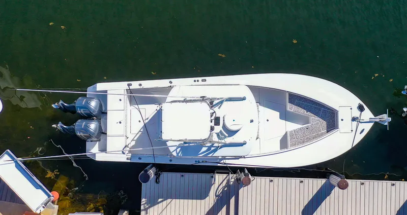 Slide: The Image of Top view of a 2005 Regulator 32 Forward Seating boat docked. - 5