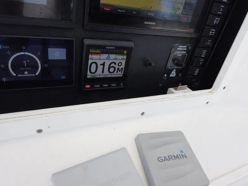 Slide: The Image of Close-up of the dashboard and Garmin navigation system on a 2005 Regulator 32 Forward Seating boat. - 9