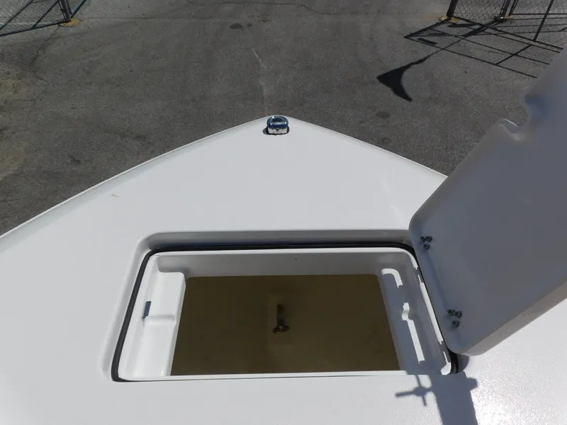 Slide: The Image of 2024 Aquasport 2200 Center Console bow storage compartment. - 11