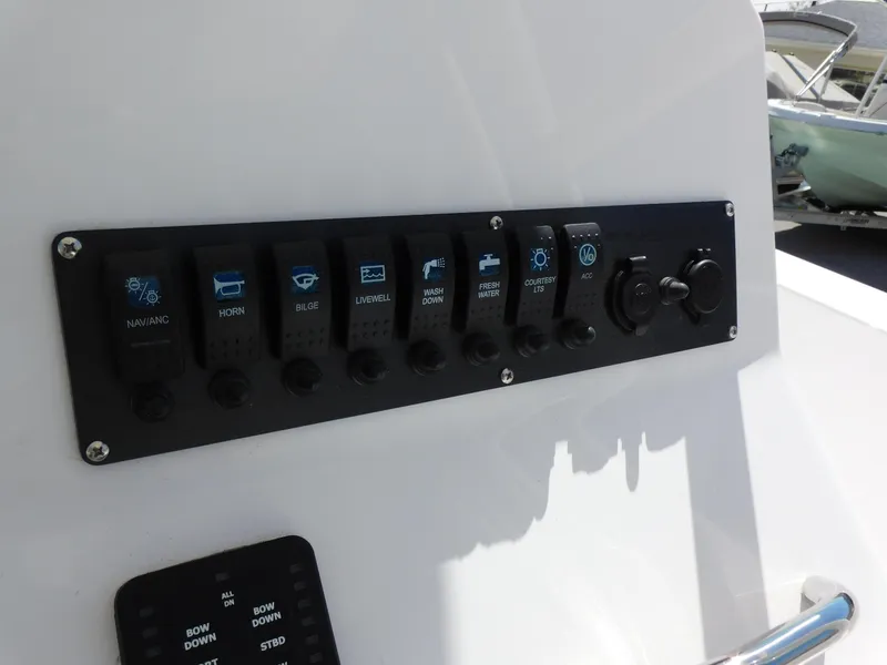 Slide: The Image of Control panel of a 2024 Aquasport 2200 Center Console boat. - 21