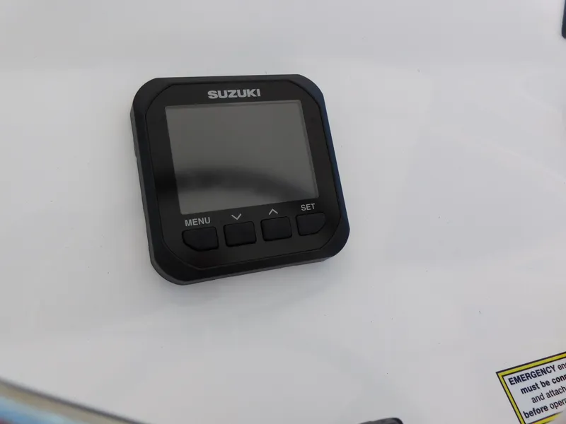Slide: The Image of Suzuki display on 2024 Aquasport 2200 Center Console boat dashboard. - 22