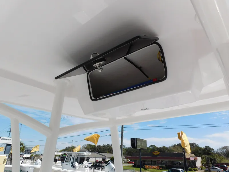 Slide: The Image of 2024 Aquasport 2200 Center Console boat with overhead storage compartment. - 26