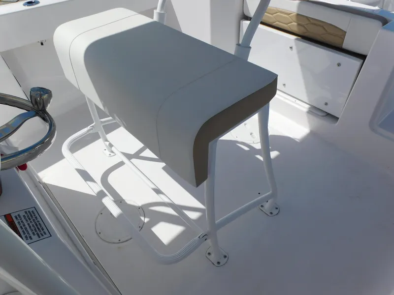 Slide: The Image of 2024 Aquasport 2200 Center Console boat seating and console area. - 28